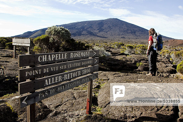 Hiker on the path to the Piton de la Fournaise volcano  La Reunion island  Indian Ocean