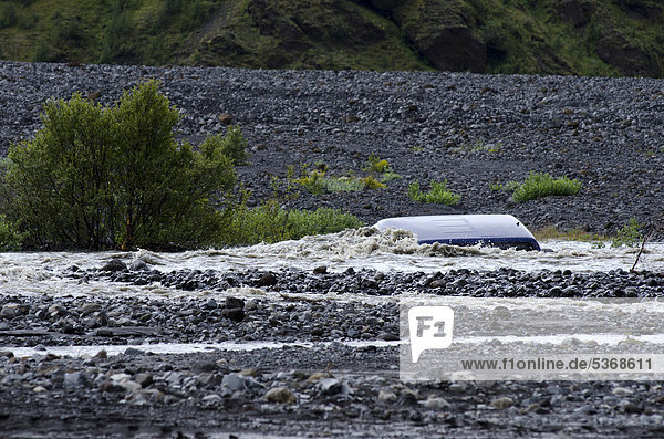A jeep  sunk in the glacial river of Kross·  _Ûrsmoerk  Iceland  Europe