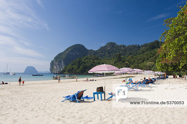 Sun loungers and parasols on the sandy beach  Farang Beach  Ko Muk or Ko Mook island  Thailand  Southeast Asia