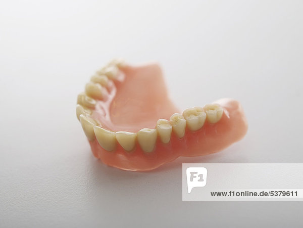 Dentures on white background  close up