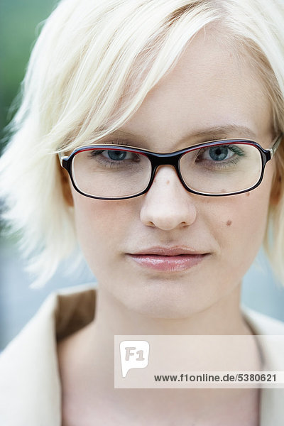 Young woman with spectacles  portrait  smiling