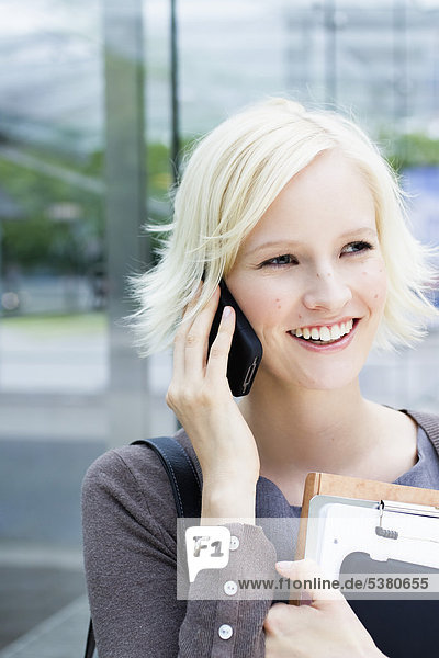 Young woman on phone  smiling