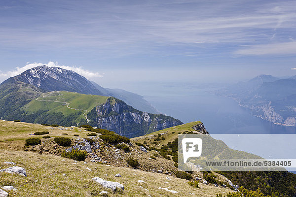 View from Monte Altissimo mountain above Nago-Torbole  Lake Garda below  Monte Baldo mountain at the back  province of Trentino  Italy  Europe