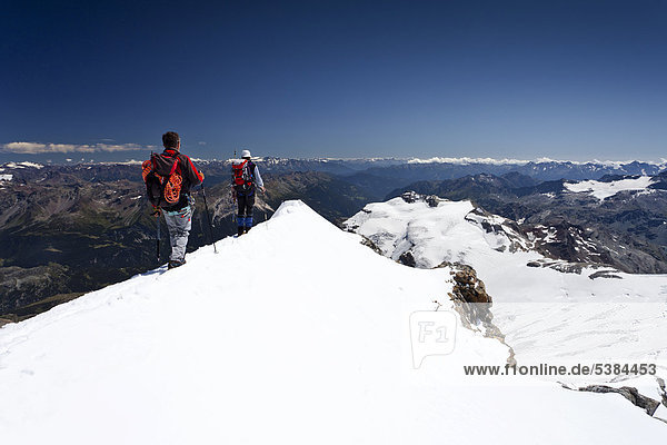 Mountaineer on the summit ridge  descent from Mt Piz Palue  Grisons  Switzerland  Europe