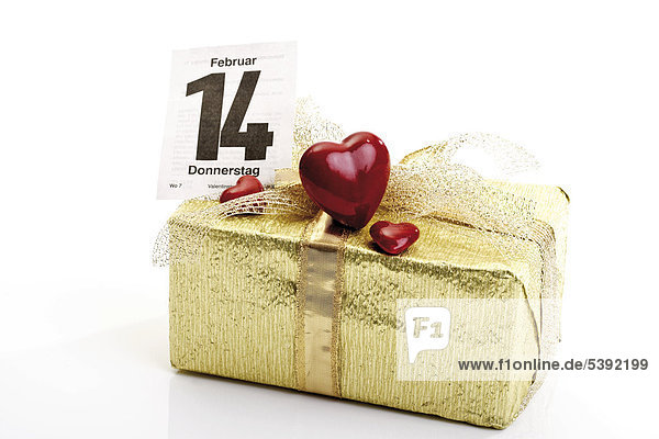Goldenes Geschenkpäckchen mit Schleife  Kalenderblatt 14. Februar - Valentinstag und roten Herzen