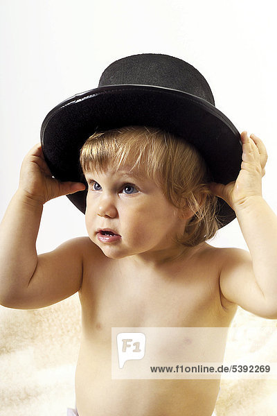 Toddler wearing a top hat