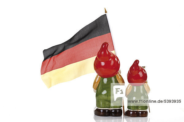 Two garden gnomes with German national flag seen from the back