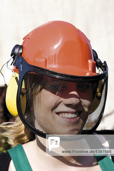 Young woman wearing a hardhat