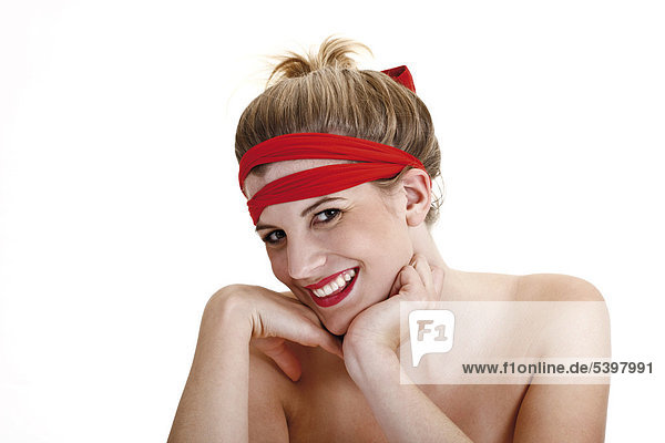 Young woman with a red headband and a ponytail  bare shoulders