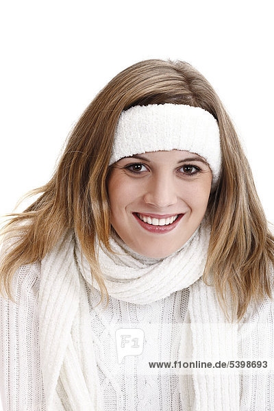Young woman wearing a white knitted jumper  scarf and headband