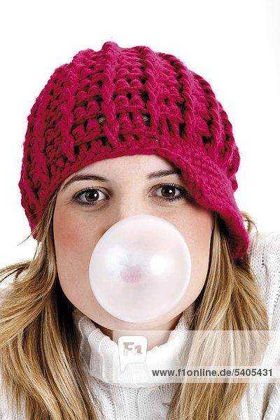 Young woman doing a gum-bubble
