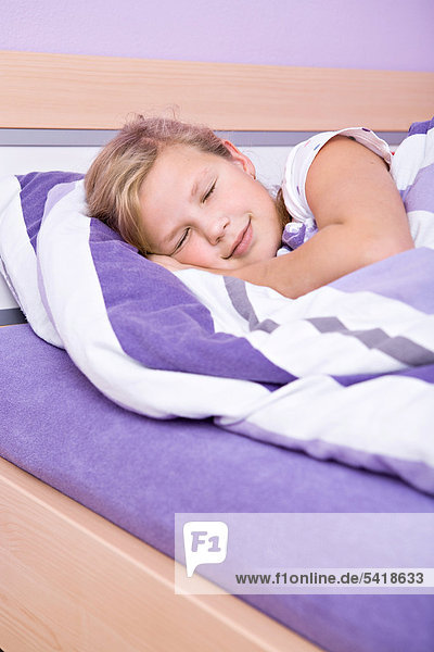 Girl  11  lying in bed