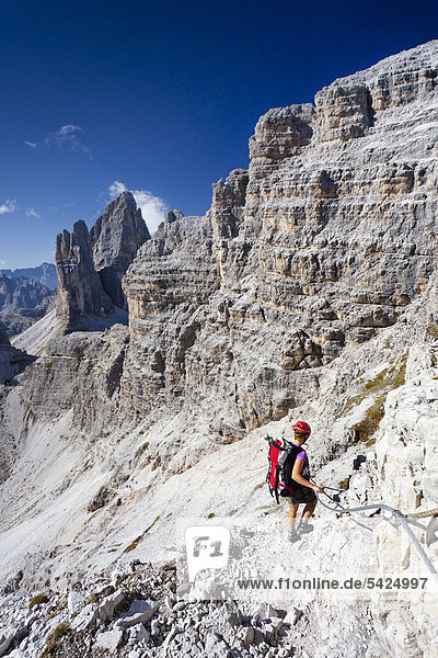 Climbers ascending Mt Paternkofel or Paterno  Tre Cime di Lavaredo massif in the back  Hochpustertal valley or Alta Pusteria  Sexten  Dolomites  South Tyrol  Italy  Europe