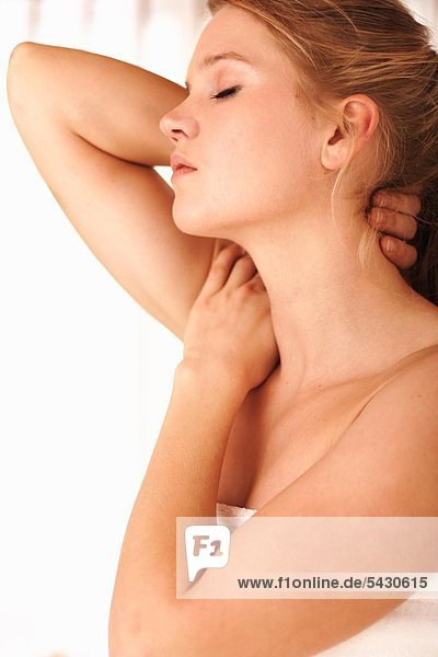 young woman is massaging her neck mouth