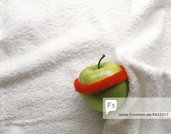 Apfel mit Schweißband auf Frottee Handtuch
