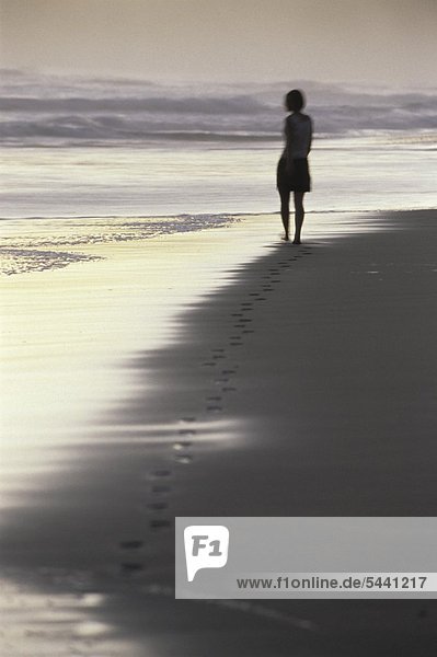 Girl walking at the beach
