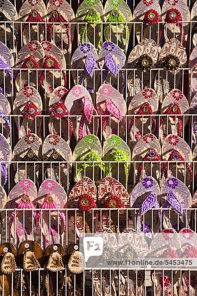 Beaded sandals displayed at a market stall