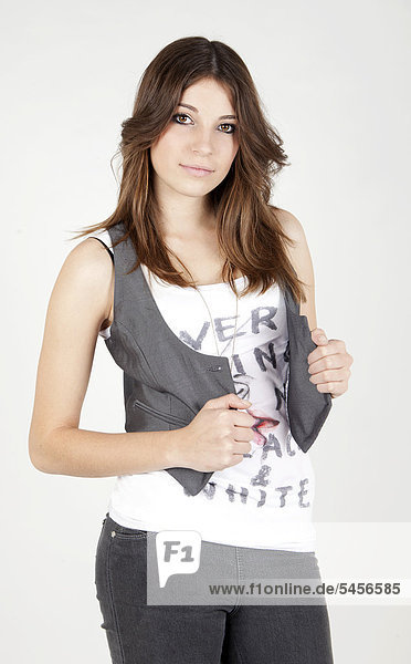 Young woman wearing a top and a vest