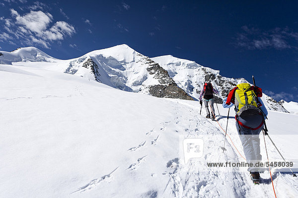 Mountaineers during the ascent to the summit of Piz Palu  Grisions  Switzerland  Europe