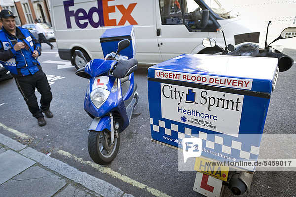 Fed-Ex driver  motorcycle with container for blood units  Marylebone  London  England  United Kingdom  Europe