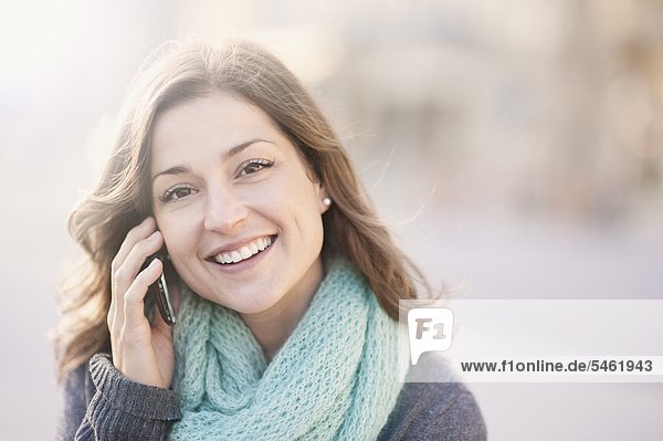 Portrait of young Woman talking on Cell phone