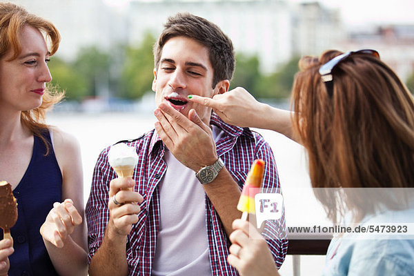 Friends eating icecreams and lollypops