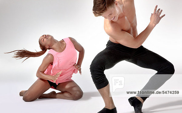 Two modern dancers in action