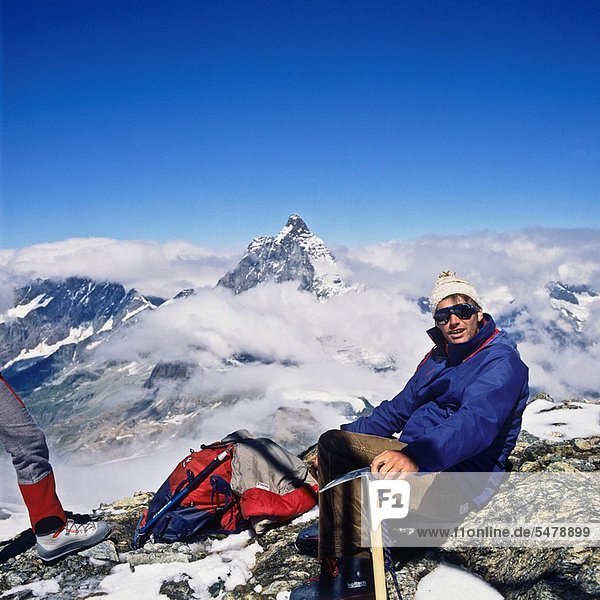 Alpinist in front of the top of the Matterhorn  Zermatt  canton Valais  Switzerland