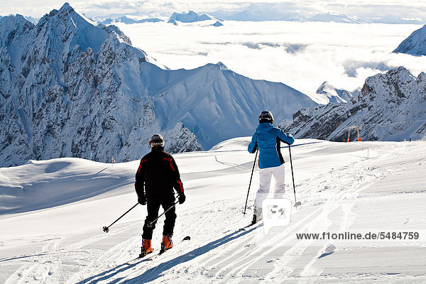 Cross-country skiers  Mt Zugspitze region in winter  Alps  Bavaria  Germany  Europe