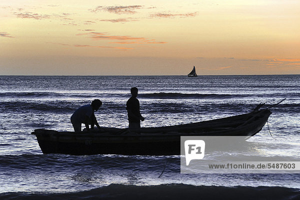 Sunset with a fishing boat  Jericoacoara near Fortaleza  Cear·  Brazil  South America