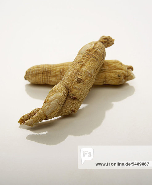 Ginseng root on white background  close up