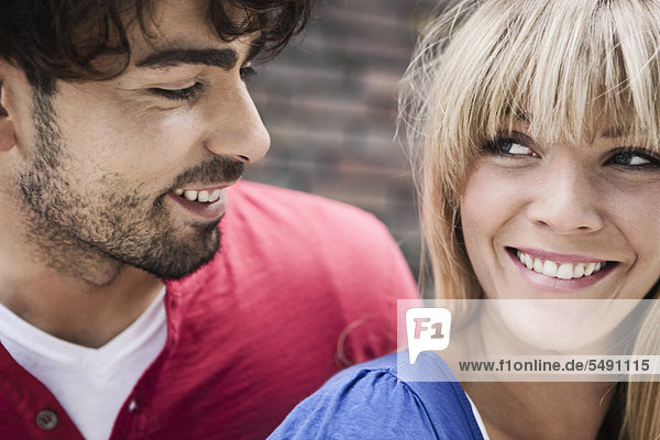 Germany  Cologne  Young couple  smiling  close up
