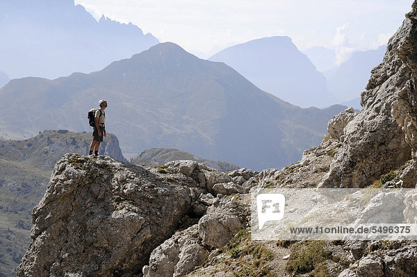 Mountaineer admiring the panoramic views from Mt Kleiner Lagazuoi  Dolomites  South Tyrol  Italy  Europe