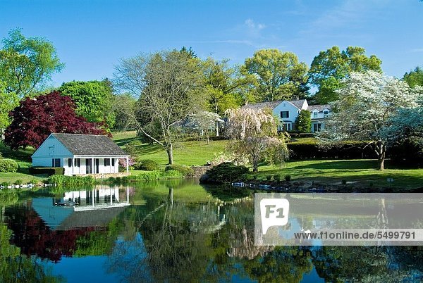 Whitewing Farm Bed and Breakfast Chester County Pennsylvania white wooden cottage beside pond