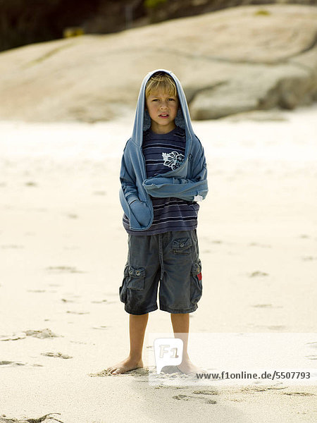 A young boy on the beach.