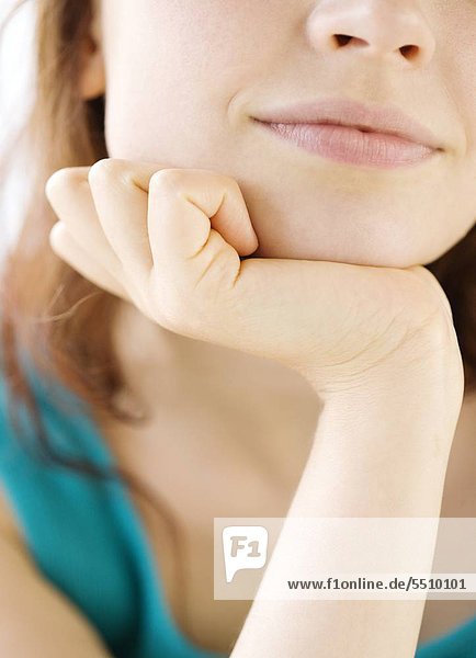 Close up of teenage Girl resting Head in der hand