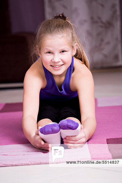 Girl  11  doing gymnastics