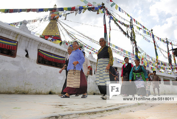 Pilgrims walking around stupa of Boudhanath  Kathmandu  Nepal  Asia