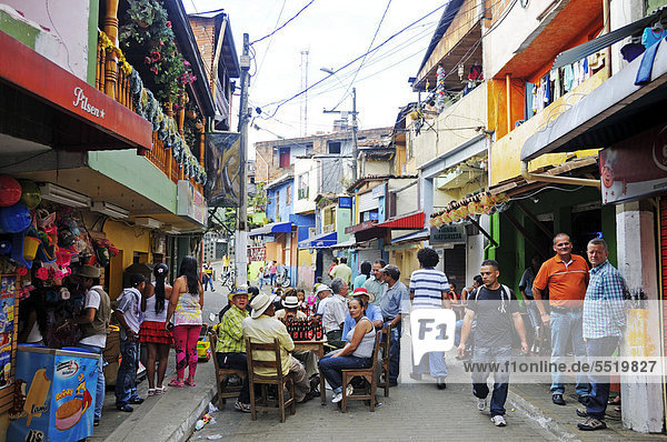 People celebrating in the streets  slums  Comuna 13  Medellin  Colombia  South America  Latin America  America