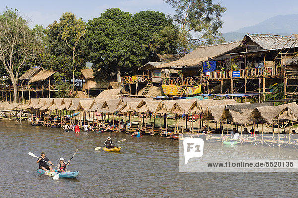 Tourists kayaking in the Water Fun Park on Nam Song River  Vang Vieng  Vientiane  Laos  Indochina  Asia