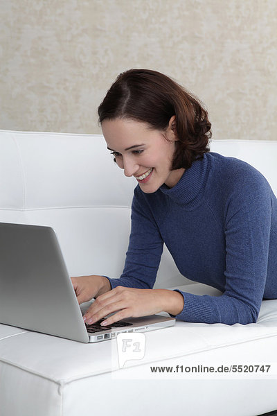 Young woman with laptop  portrait