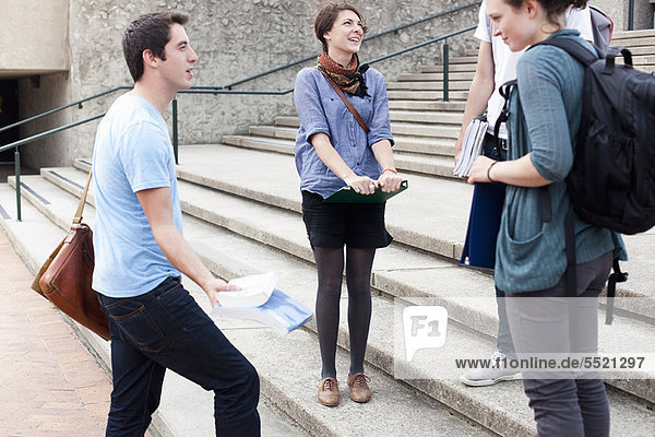 Students talking on campus steps