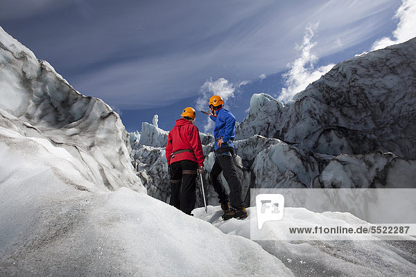 Hikers admiring glacial landscape