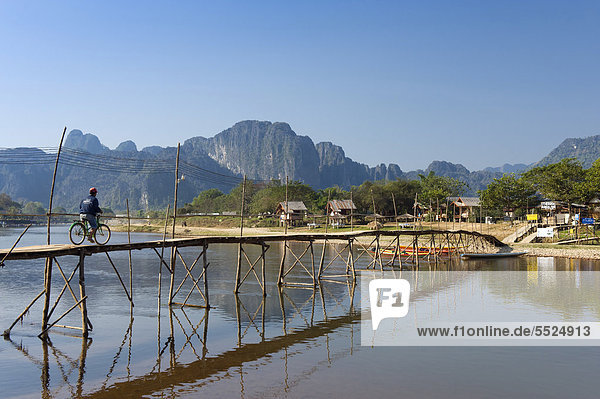 Bamboo bridge over the Nam Song River  karst mountains  Vang Vieng  Vientiane  Laos  Indochina  Asia