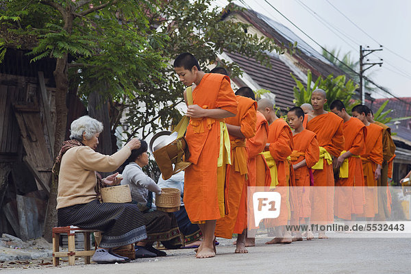 Monks on their morning alms round  Luang Prabang  Laos  Indochina  Asia