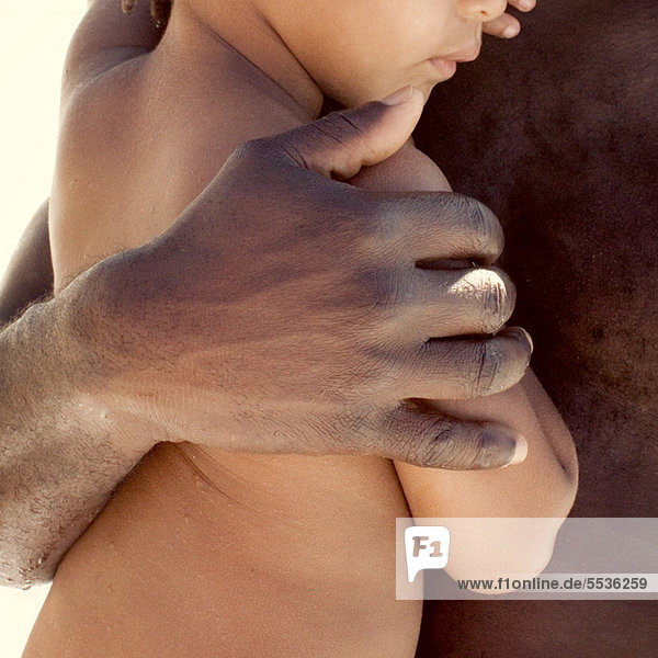 Father holding child  cropped