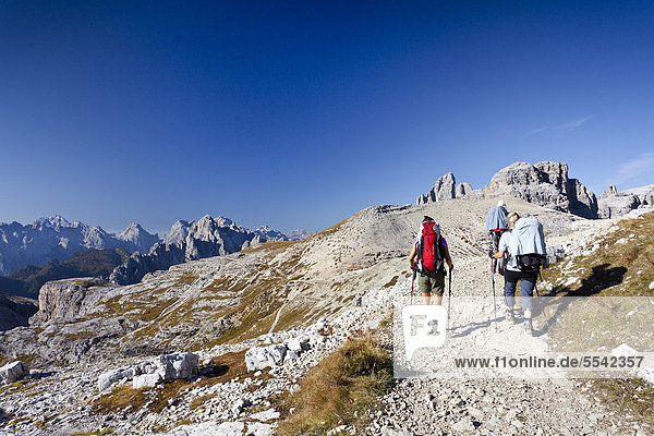 Hikers on the Buellelejoch Pass during the ascent to Paternkofel Mountain  looking towards Paternkofel Mountain  the Three Peaks and the Cadini Group  Sesto  Alta Pusteria  Dolomites  Alto Adige  Italy  Europe
