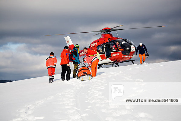 Rescue operation with a rescue helicopter in the Thuringian Slate Mountains  Thuringia  Germany  Europe