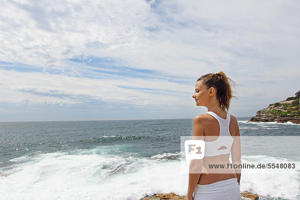 Young Woman Standing at Seashore