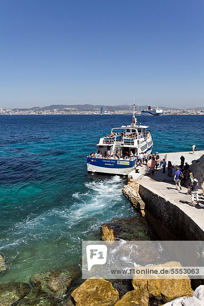 Tourists arriving by boat on the island Ile d'If  Frioul Archipelago  bay of Marseille  or Marseilles  France  Europe